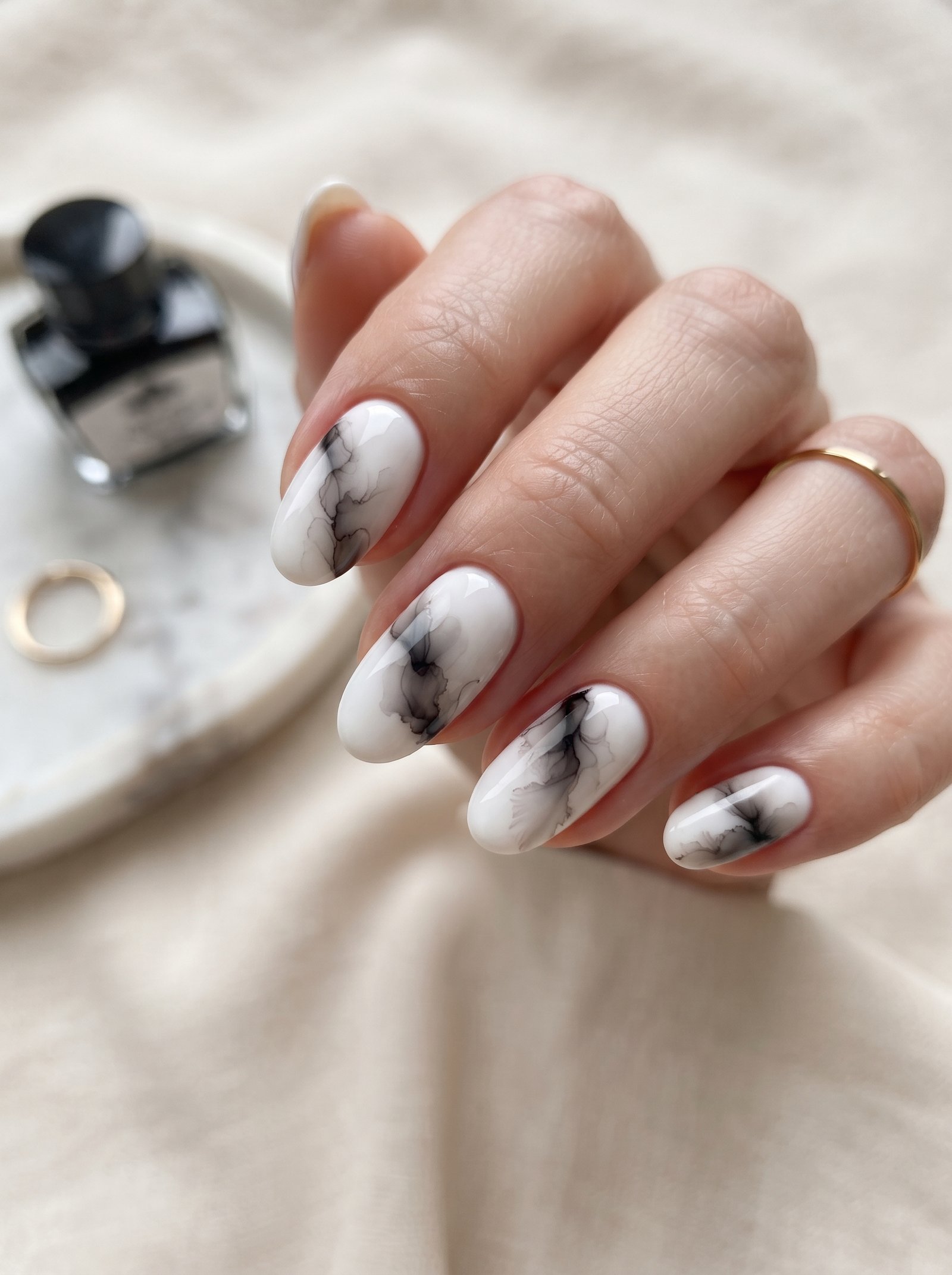 Trending 2026 ink drop nail art design with smoky watercolor marble fluid effects