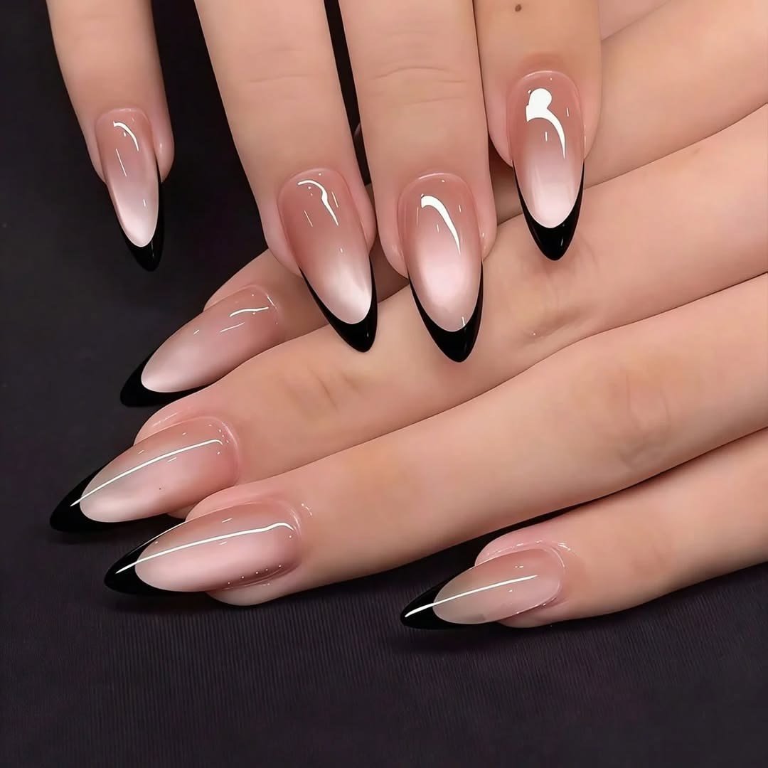 Pair these chic black French tips with delicate silver or minimalist gold rings to complement the dark contrast. A glossy topcoat will maintain that glass-like shine, while pairing this manicure with neutral tailored outfits or a classic LBD enhances the