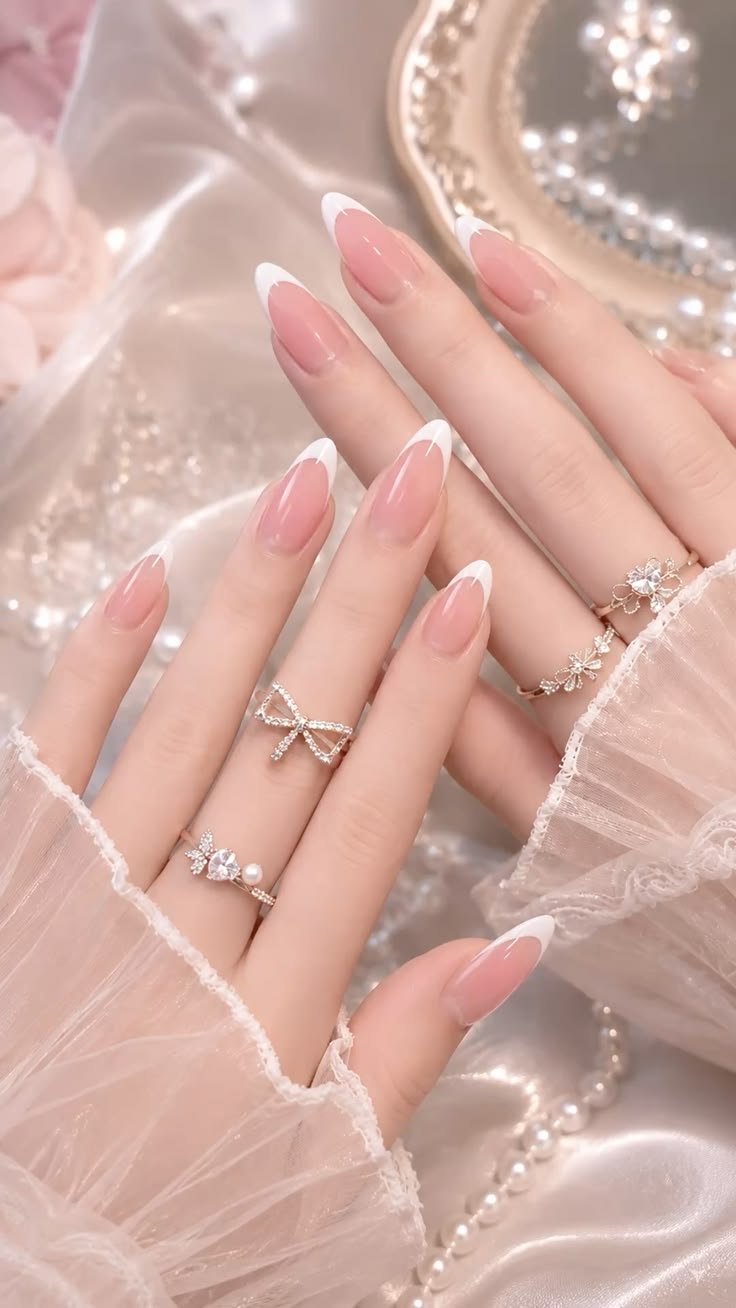 Pink French tip nails are timeless, feminine, and effortlessly classy. This glossy almond manicure is perfect for bridal looks, date nights, special occasions, and soft glam everyday styling.